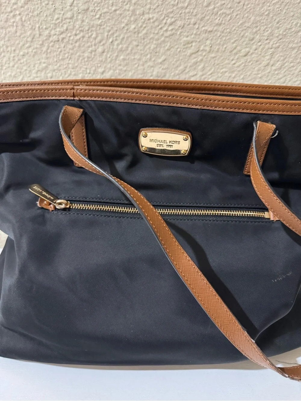 Michael Kors Black Tote with Brown Trim and Gold Plate